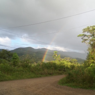 A rainbow greeted me while I was waiting for the bus to Villas Mastatal.