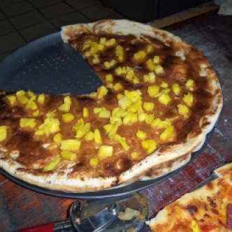 Dessert pizza with dulce de leche and pineapple.