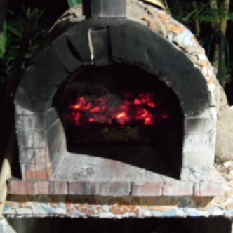 Pizza cooking in the brick oven.